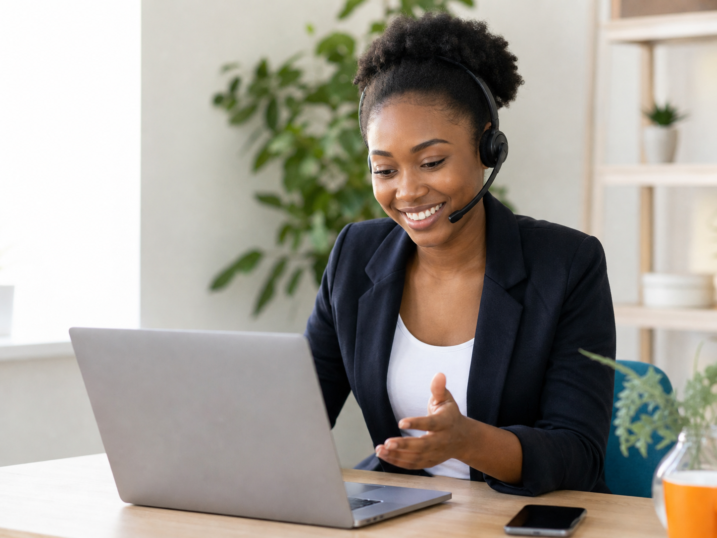 Young African customer service agent assisting a learner online